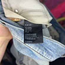 Load image into Gallery viewer, Amiri MX1 Ripped Skinny Jeans Size 33”
